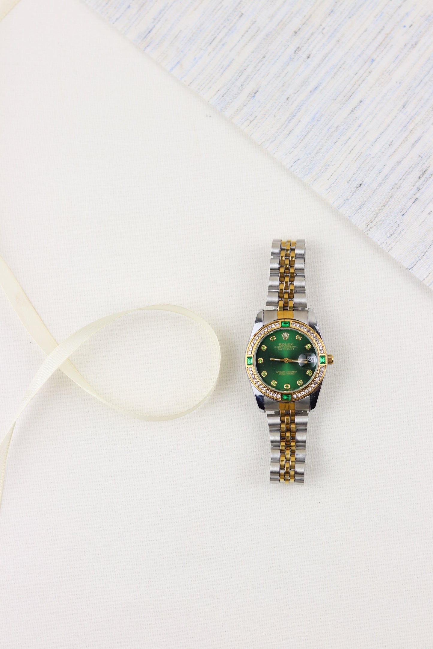 Rol-ex Gilded Green Datejust Watch