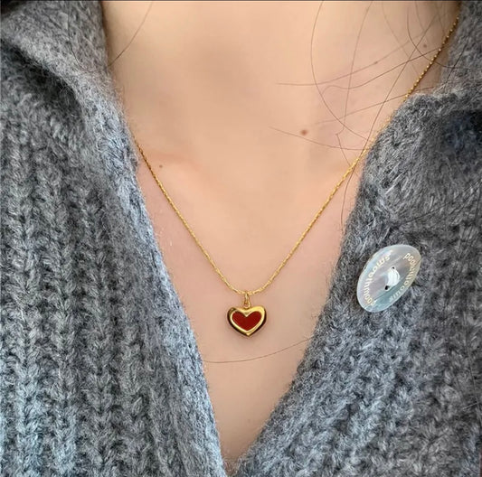 Red heart necklace with a gold-toned chain