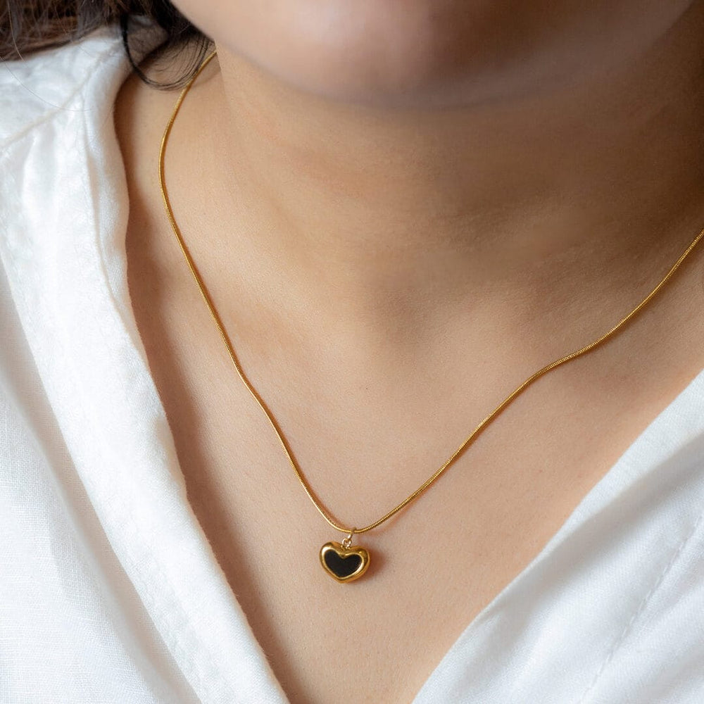 black heart necklace with a gold-toned chain