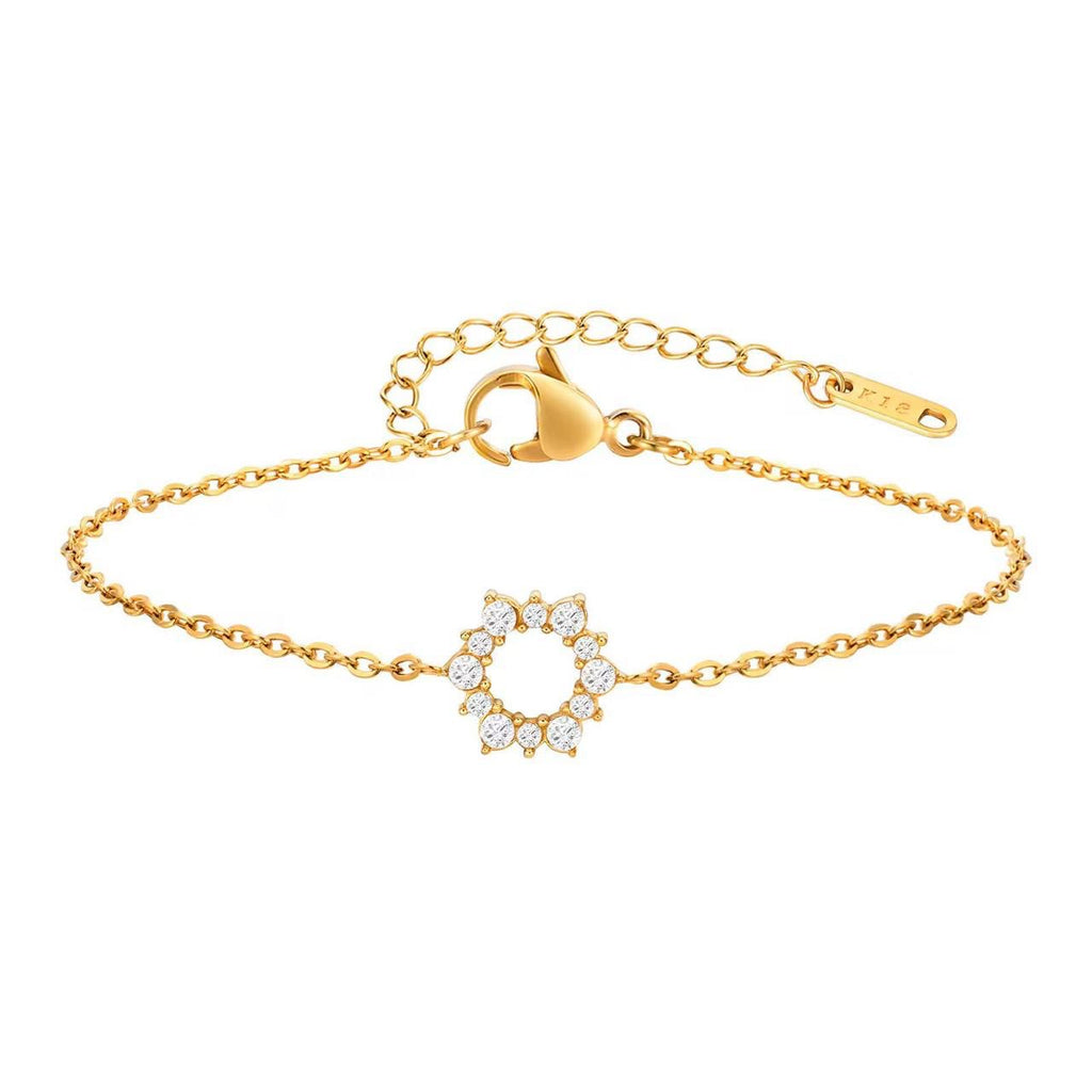 Elegant gold tennis bracelet with emerald cut center stone