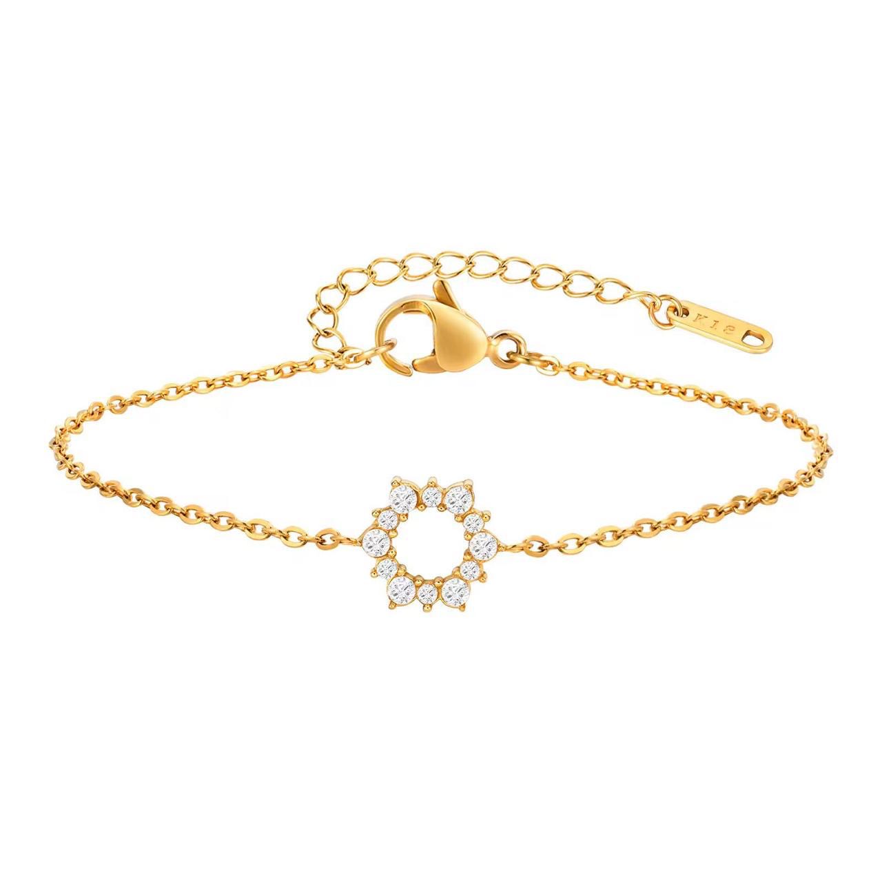 Elegant gold tennis bracelet with emerald cut center stone