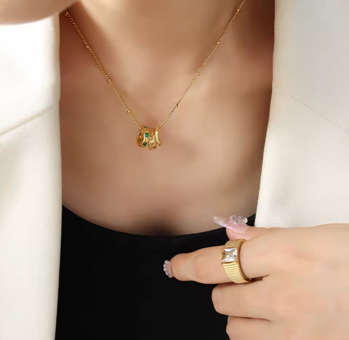 Gold Interlocking Necklace with Emerald Crystal Accents
