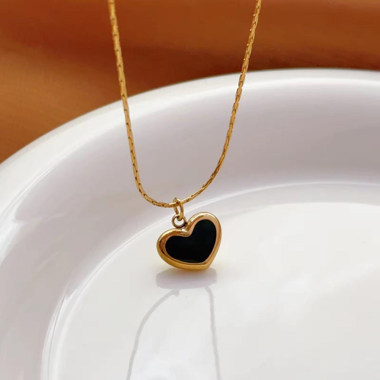 black heart necklace with a gold-toned chain