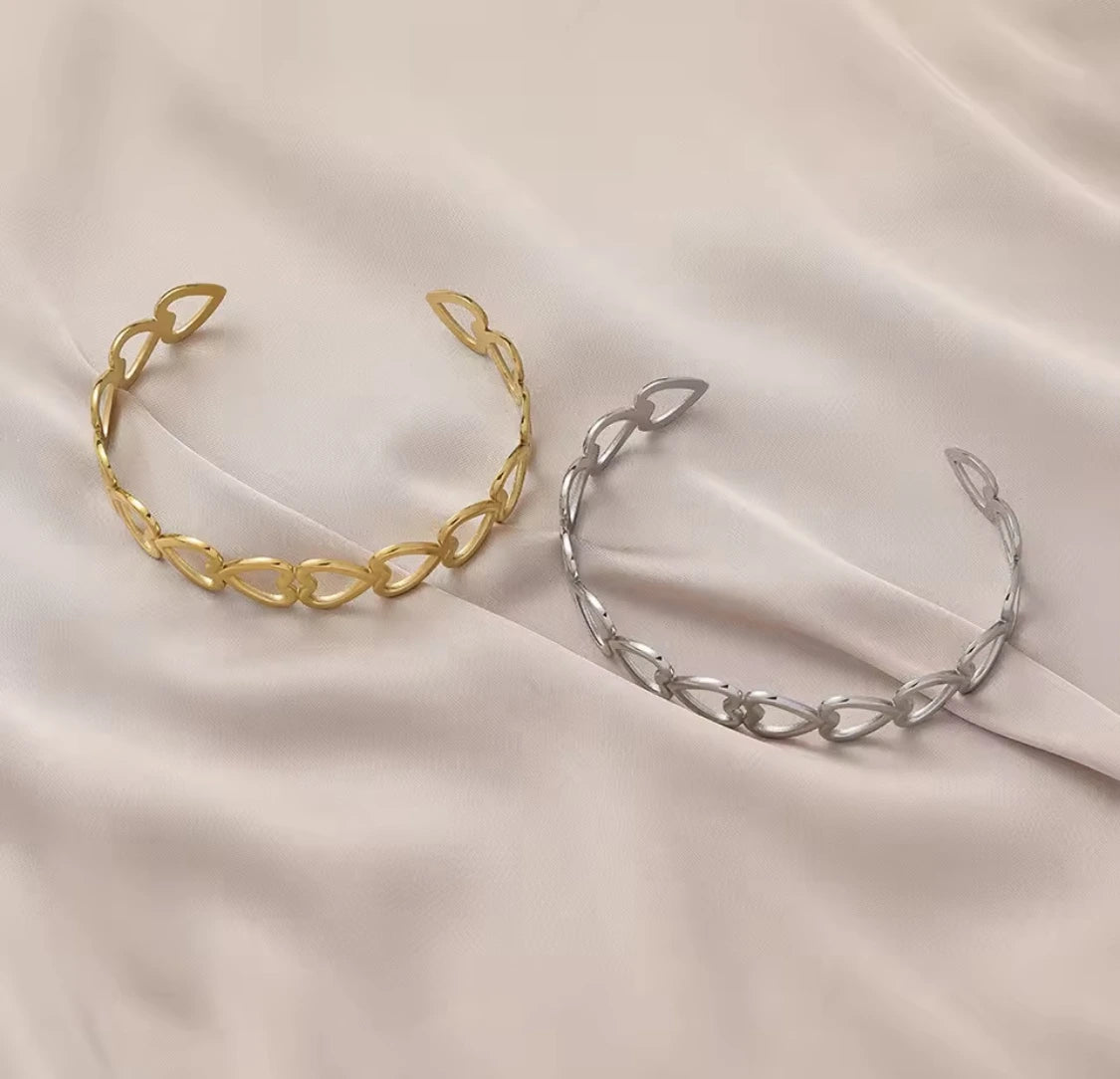 woman wearing golden heart open cuff bangle daily wear pakistan