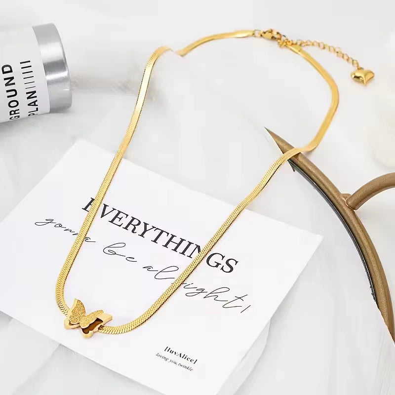 Close-up of gold plated butterfly pendant necklace featuring premium stainless steel craftsmanship, hypoallergenic and anti-tarnish jewellery.