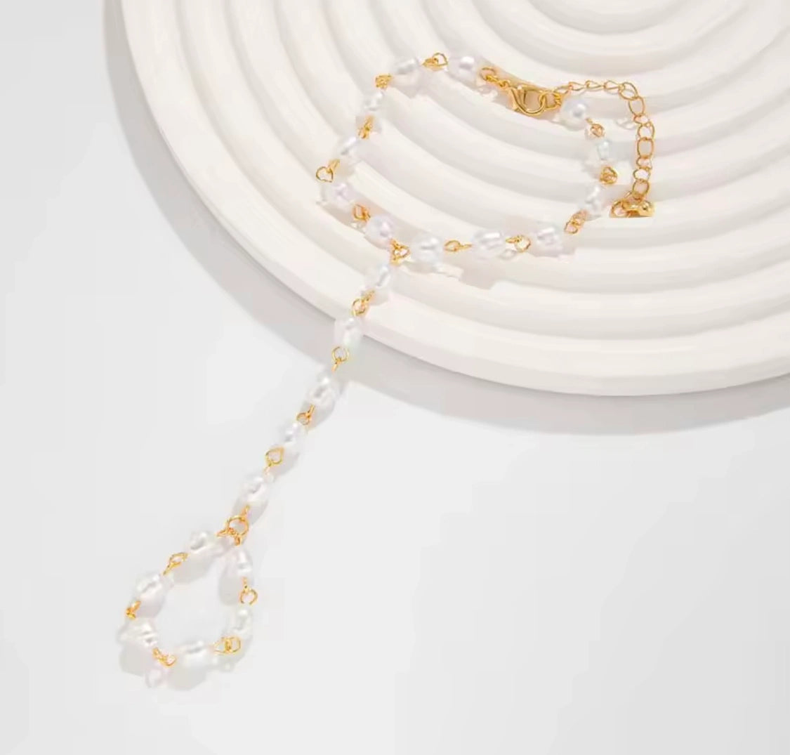 Beautiful white pearl finger bracelet accessory for women showcasing timeless pearl elegance and sophistication