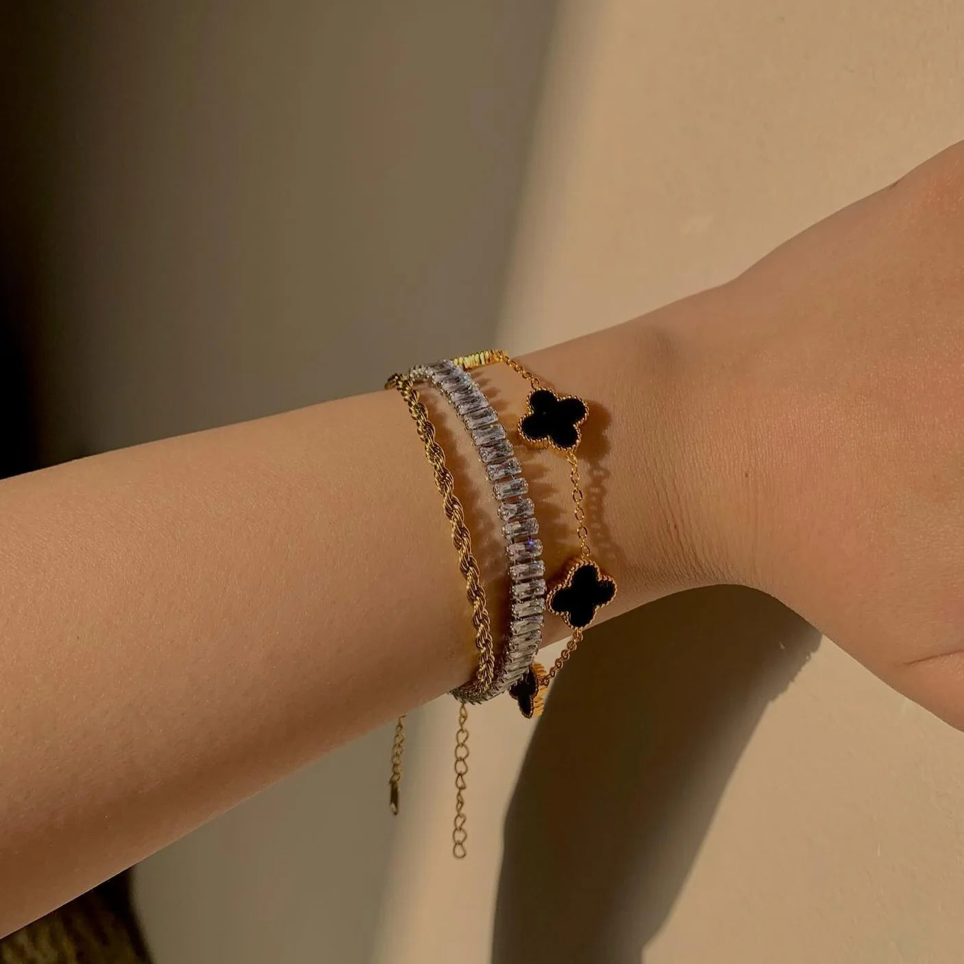 Black clover, tennis and twisted bracelet stack